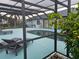 Inviting pool area with screened enclosure and lounge chairs at 975 Coronado Dr, Punta Gorda, FL 33950
