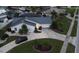 Single story home with a metal roof, pool, and driveway at 975 Coronado Dr, Punta Gorda, FL 33950
