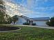 House exterior featuring a metal roof and landscaping at 975 Coronado Dr, Punta Gorda, FL 33950