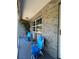 Cozy screened porch with comfortable seating and views of the garden at 40610 State Road 64 E, Myakka City, FL 34251