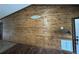 Inviting entryway showcasing a rustic wood feature wall at 40610 State Road 64 E, Myakka City, FL 34251