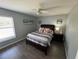 Bedroom with a bed, pillows, and nightstand at 40610 State Road 64 E, Myakka City, FL 34251