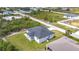 Aerial view of the property highlighting the home's layout and surrounding landscape at 13527 Ainsworth Ln, Port Charlotte, FL 33981