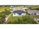 Aerial view showing the backyard and location of the property in the surrounding area at 13527 Ainsworth Ln, Port Charlotte, FL 33981