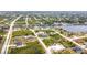 A wide aerial view of a residential area with access to a river and a canal, creating a waterfront community at 13527 Ainsworth Ln, Port Charlotte, FL 33981