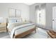 Serene bedroom with soft colors, natural light, a comfortable bed, and stylish decor at 13527 Ainsworth Ln, Port Charlotte, FL 33981