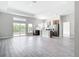Open floor plan featuring kitchen with stainless steel appliances and view into the living area at 13527 Ainsworth Ln, Port Charlotte, FL 33981
