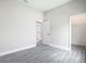 This bedroom has neutral paint and light grey wood-look floors at 14112 Monserrate Ln, Port Charlotte, FL 33981