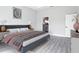 Serene bedroom with a comfortable bed, neutral decor, and ensuite bathroom at 14112 Monserrate Ln, Port Charlotte, FL 33981