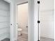 Walk-in closet and connecting bathroom featuring wire shelving at 14112 Monserrate Ln, Port Charlotte, FL 33981