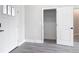 Bright entryway with luxury vinyl plank flooring and an open closet for convenient storage at 14112 Monserrate Ln, Port Charlotte, FL 33981