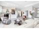 Spacious open-concept living room and kitchen featuring modern decor and abundant natural light at 14112 Monserrate Ln, Port Charlotte, FL 33981