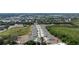 Aerial view of townhouses and distant city view at 3048 Victoria Inlet Dr, Holiday, FL 34691