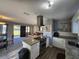 Modern kitchen with white cabinets, granite countertops, and island at 2309 22Nd W Ave, Bradenton, FL 34205