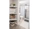 Clean bathroom with updated shower and stylish shelving at 4615 Lords Ave, Sarasota, FL 34231