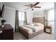 Spacious bedroom with a king-size bed and ceiling fan at 4615 Lords Ave, Sarasota, FL 34231