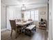 Charming dining room with a table, bench, and updated light fixture at 4615 Lords Ave, Sarasota, FL 34231