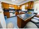 Kitchen with wood cabinets and blue tile countertops at 3305 Hickman Ave, Plant City, FL 33563