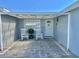 Charming front porch with rocking chairs, a paved patio, and a pergola at 4229 Floramar Ter, New Port Richey, FL 34652