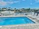Inviting pool with lounge chairs, offering waterfront views at 4229 Floramar Ter, New Port Richey, FL 34652