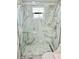 Updated bathroom with a large walk-in shower and marble tile at 4229 Floramar Ter, New Port Richey, FL 34652