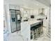 Modern kitchen with stainless steel appliances and a large quartz island at 4229 Floramar Ter, New Port Richey, FL 34652