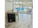Breakfast nook with pool view, sliding doors, and marble floors at 4229 Floramar Ter, New Port Richey, FL 34652