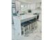 Spacious kitchen with island, quartz countertops, and stainless steel appliances at 4229 Floramar Ter, New Port Richey, FL 34652