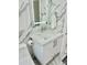 Bright bathroom featuring a white vanity and marble tile at 4229 Floramar Ter, New Port Richey, FL 34652