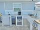 Luxury outdoor kitchen with granite countertops and stainless steel appliances at 4229 Floramar Ter, New Port Richey, FL 34652