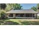 Enclosed back porch area with a washing machine hookup and lots of space at 406 E Young St, Plant City, FL 33563