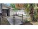 Backyard features a fenced in area with concrete at 406 E Young St, Plant City, FL 33563