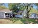 Backyard featuring storage sheds and grass at 406 E Young St, Plant City, FL 33563