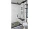 Modern bathroom with a glass enclosed shower, white subway tile and a black bench at 406 E Young St, Plant City, FL 33563