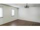 Bright bedroom featuring wood floors, lots of natural light, and neutral paint at 406 E Young St, Plant City, FL 33563