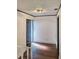 Inviting entryway features dark trim, a modern light fixture, and wood flooring at 406 E Young St, Plant City, FL 33563