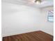 Bright bedroom with wood-look floors and neutral walls at 406 E Young St, Plant City, FL 33563