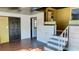 Home entryway with stairs to a loft and dark door at 406 E Young St, Plant City, FL 33563