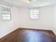 Spacious bedroom featuring wood-look floors and large windows at 406 E Young St, Plant City, FL 33563