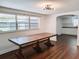 Simple dining area with a rustic wood table and view to kitchen at 406 E Young St, Plant City, FL 33563
