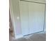 Spacious double-door closet with white panel doors at 12122 Clarendon Ave, Port Charlotte, FL 33981