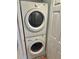 Convenient laundry closet with stackable Frigidaire washer and dryer at 6035 Sea Ranch Dr # 202, Hudson, FL 34667