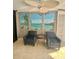 Lobby lounge with comfortable seating and beach mural at 6035 Sea Ranch Dr # 202, Hudson, FL 34667