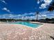 Resort-style pool with lake view at 13824 Orange Sunset Dr # 202, Tampa, FL 33618