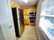 Modern kitchen with stainless steel appliances and wood cabinets at 13824 Orange Sunset Dr # 202, Tampa, FL 33618