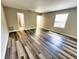 Bright and airy living room with wood-look floors at 13824 Orange Sunset Dr # 202, Tampa, FL 33618