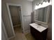 Updated bathroom with vanity, mirror, and shower at 13824 Orange Sunset Dr # 202, Tampa, FL 33618