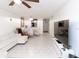 Open living room and dining area with tile floors at 4222 Trucious Pl # 4222, New Port Richey, FL 34652