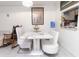 Casual dining area with white table and bench seating at 4222 Trucious Pl # 4222, New Port Richey, FL 34652