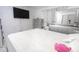Bedroom with a large bed, dresser, and TV at 4222 Trucious Pl # 4222, New Port Richey, FL 34652